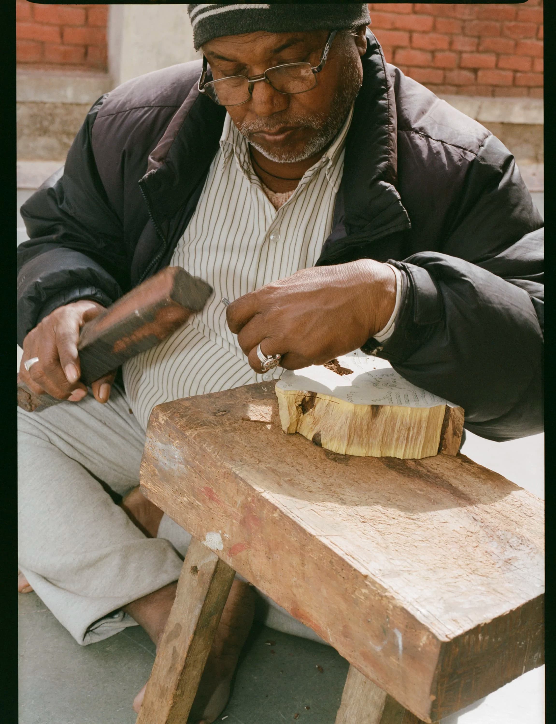 Block carving with hammer and chisel